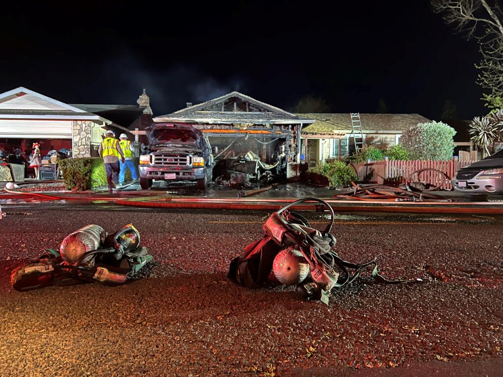 A fire broke out at at home in the 400 block of Garfield Drive in Petaluma around 7:20 p.m. on April 7, 2022. It was extinguished quickly, but not before causing major damage to the garage, home and a truck. (Emily Charrier/Argus-Courier)
