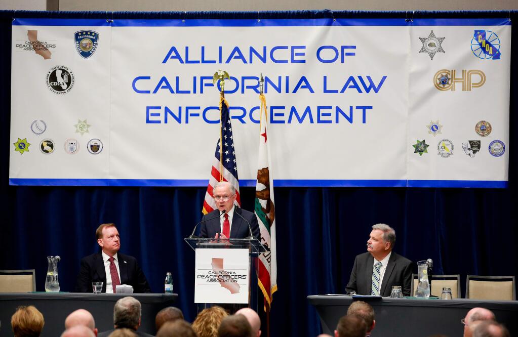 FILE - In this March 7, 2018, file photo, U.S. Attorney General Jeff Sessions addresses the California Peace Officers' Association at the 26th annual Law Enforcement Legislative Day in Sacramento, Calif. The Trump administration is suing California over a law that aims to give the state power to override the sale of federal lands. The U.S. Department of Justice filed lawsuit against the state of California, Monday, April 2, 2018. It's the latest battle between President Donald Trump and the nation's most populous state, where Democrats have tried aggressively to thwart the president's agenda. (AP Photo/Rich Pedroncelli, File)