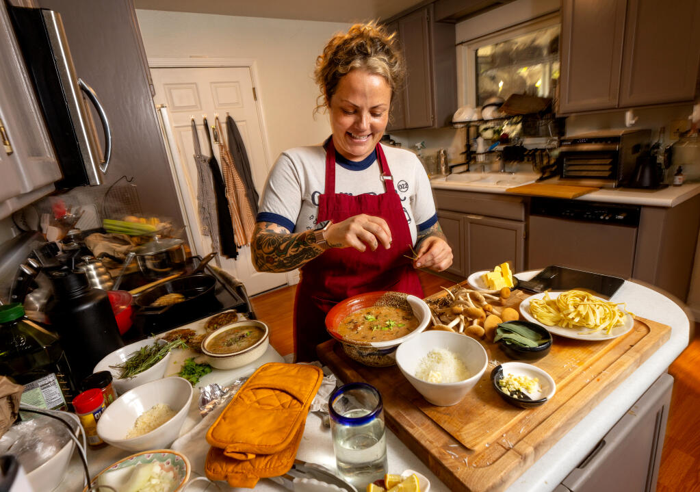 Amanda Janney prepares Pioppino Pasta with Brown Butter and Sage using her favorite culinary mushroom in her Santa Rosa kitchen. Janney started growing exotic mushrooms as a hobby before starting KM Mushrooms in her backyard shed and greenhouse. (John Burgess / The Press Democrat)