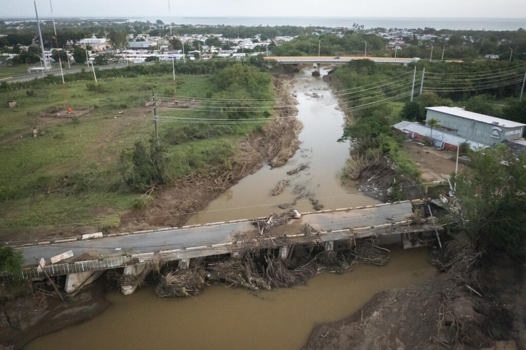 View of a damaged bridge after Hurricane Fiona hit Villa Esperanza in Salinas, Puerto Rico, Wednesday, Sept. 21, 2022. (AP Photo/Alejandro Granadillo)