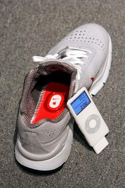 The Nike Air Zoom Moire is photographed alongside an iPod and the Nike+iPod Sport Kit in New York, Tuesday May 23, 2006. Nike and Apple introduced the Air Zoom Moire, the first footwear designed to talk to Apple's iPod nano, connecting you to the ultimate personal running and workout experience. The Air Zoom Moire connects to iPod through the wireless Nike'iPod Sport Kit. With Nike' footwear connected to iPod nano, information on time, distance, calories burned and pace is stored on iPod and displayed on the screen; real-time audible feedback also is provided through headphones. The kit which includes an in-shoe sensor and a receiver that attaches to iPod will be available within 60 days for a suggested retail price of $29 through the Apple store. (AP Photo/Mary Altaffer)