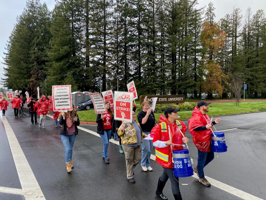 California State University faculty participate in the first-day of a planned five-day strike at the Sonoma State University campus entrance off Rohnert Park Expressway in Rohnert Park, Monday, Jan. 22, 2024. (Christopher Chung / The Press Democrat)
