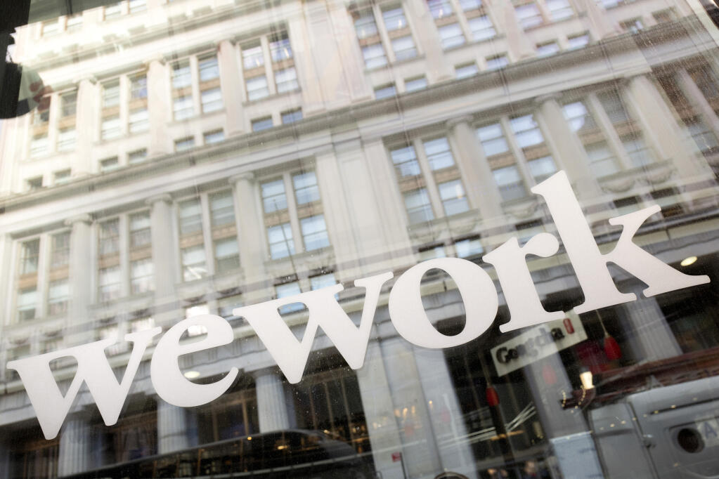 WeWork offices are shown, Thursday, Jan. 16, 2020 in New York. WeWork has filed for Chapter 11 bankruptcy protection, marking a stunning fall for the office sharing company once seen as a Wall Street darling that promised to upend the way people went to work around the world. (AP Photo/Mark Lennihan, File)