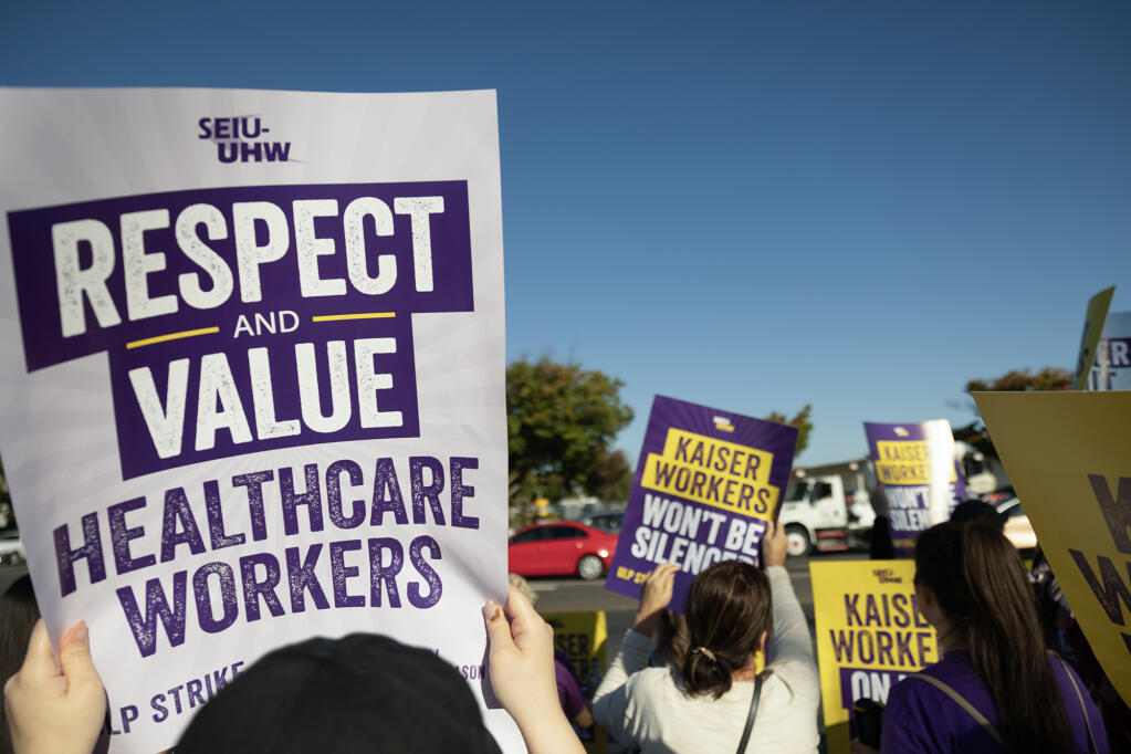 Kaiser Permanente employees on strike on Oct. 4, 2023. The workers held a demonstration in front of the Kaiser Permanente South Sacramento location demanding higher wages and more staffing. Photo by Miguel Gutierrez Jr., CalMatters