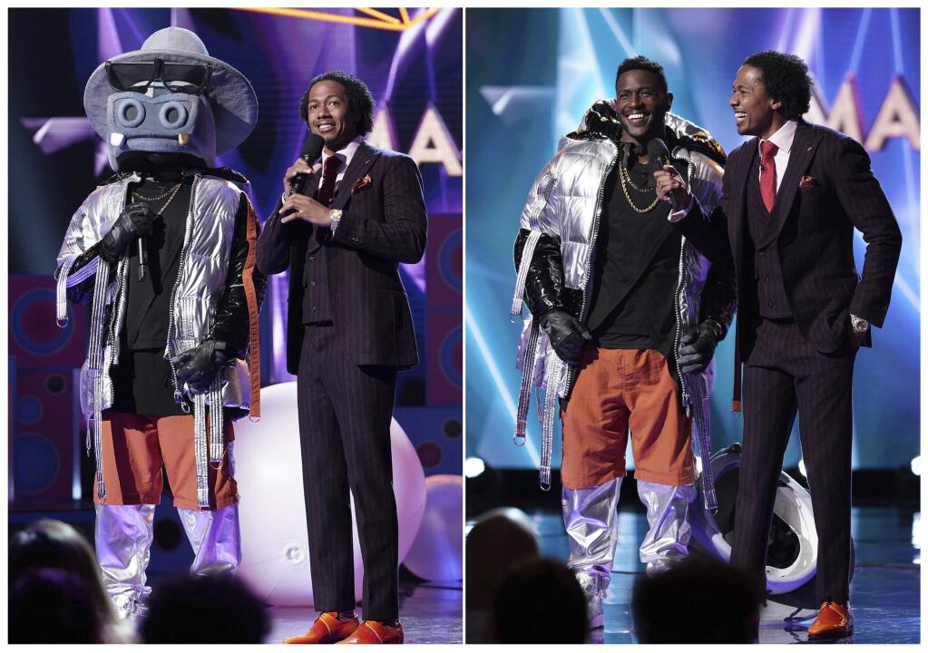 This combination of photos released by Fox shows NFL wide receiver Antonio Brown in a hippo costume as he stands with host Nick Cannon, left, and Brown after he revealed his identity in the series premiere of 'The Masked Singer,' which aired on Jan. 2. The Nielsen company said that 9.37 million people watched the series debut last Wednesday. That was the biggest audience to watch the premiere of any unscripted show on television in more than seven years. (Michael Becker/FOX via AP)