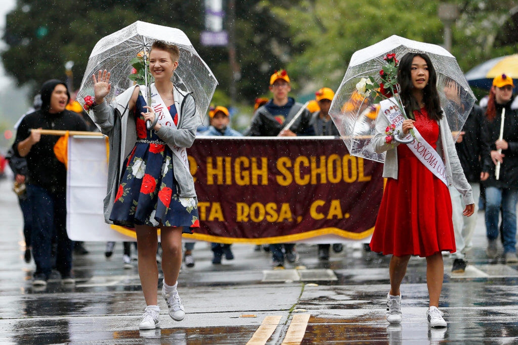 Miss Sonoma County Rhiannon Jones, left, and Miss Sonoma County’s Outstanding Teen Emma Chen walk the parade route during the 125th annual Luther Burbank Rose Parade in Santa Rosa, Saturday, May 18, 2019. (Alvin Jornada / The Press Democrat file)