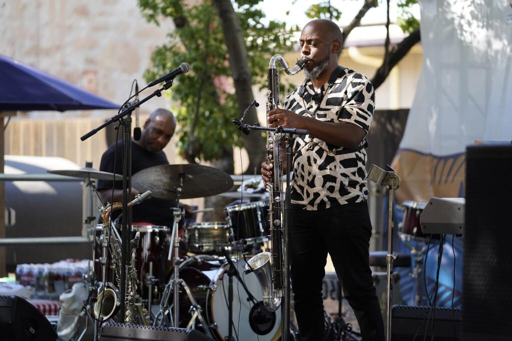 Marcus Strickland, right, performs during the inaugural Blue Note Jazz Festival Napa Valley at the Charles Krug Winery in St. Helena, Calif., Friday, July 29, 2022. The event was inspired by the East Coast version of the festival that has taken place at major venues across New York City for several years. (AP Photo/Eric Risberg)