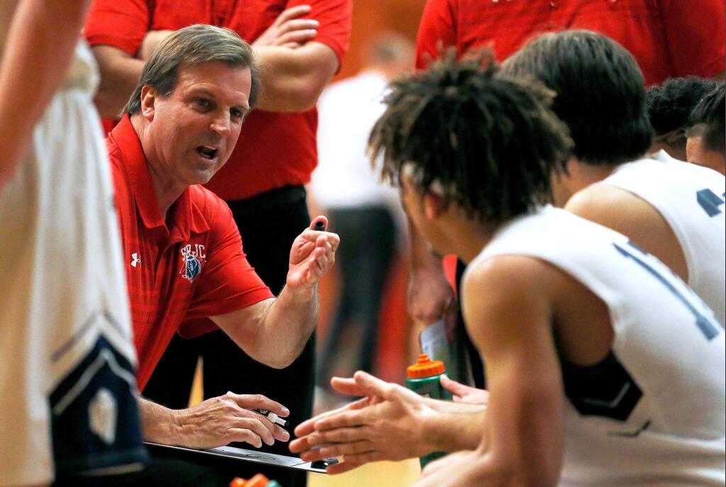 SRJC head coach Craig McMillan talks to his player during a timeout in the second half of a first-round playoff game against Las Positas College in Santa Rosa on Friday, March 1, 2019. (Alvin A.H. Jornada / The Press Democrat)