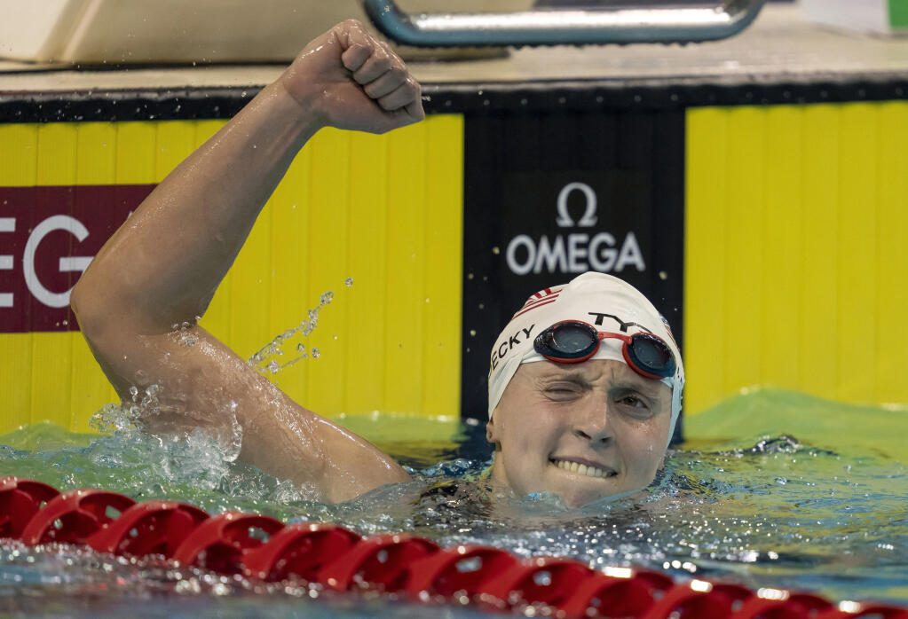 Katie Ledecky celebrates after breaking the world record in the 1,500-meter freestyle at October’s swimming world championships in Toronto. (Frank Gunn / Canadian Press)