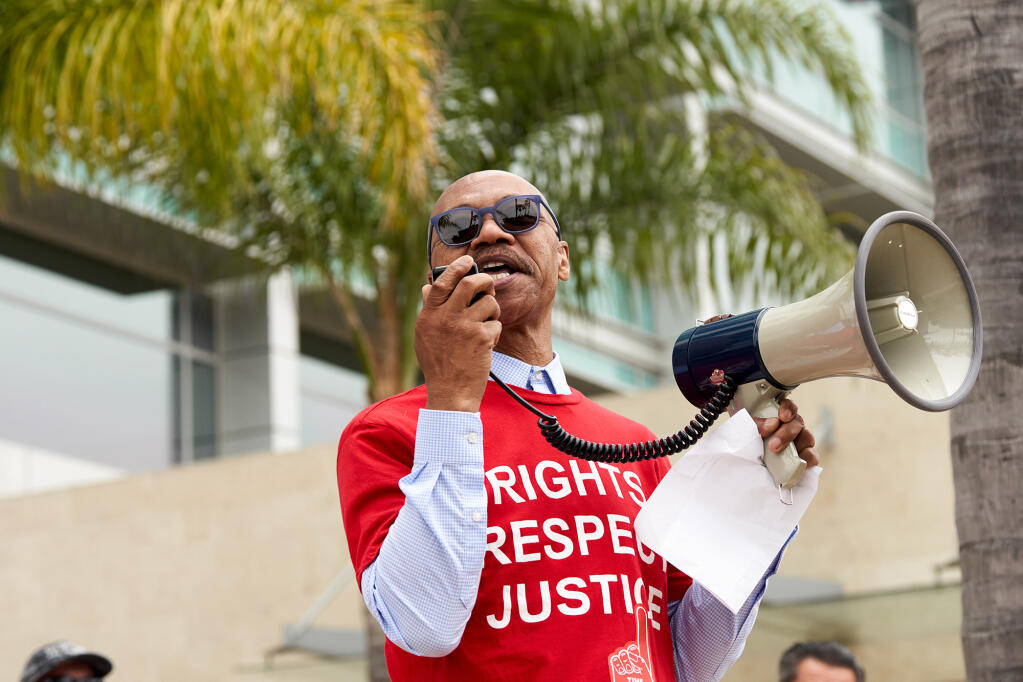 Charles Toombs, president of California Faculty Association  and professor of Africana Studies at San Diego State University, speaks to union members during a rally outside the CSU Chancellor's office in Long Beach on May 23, 2023. Photo by Lauren Justice for CalMatters.