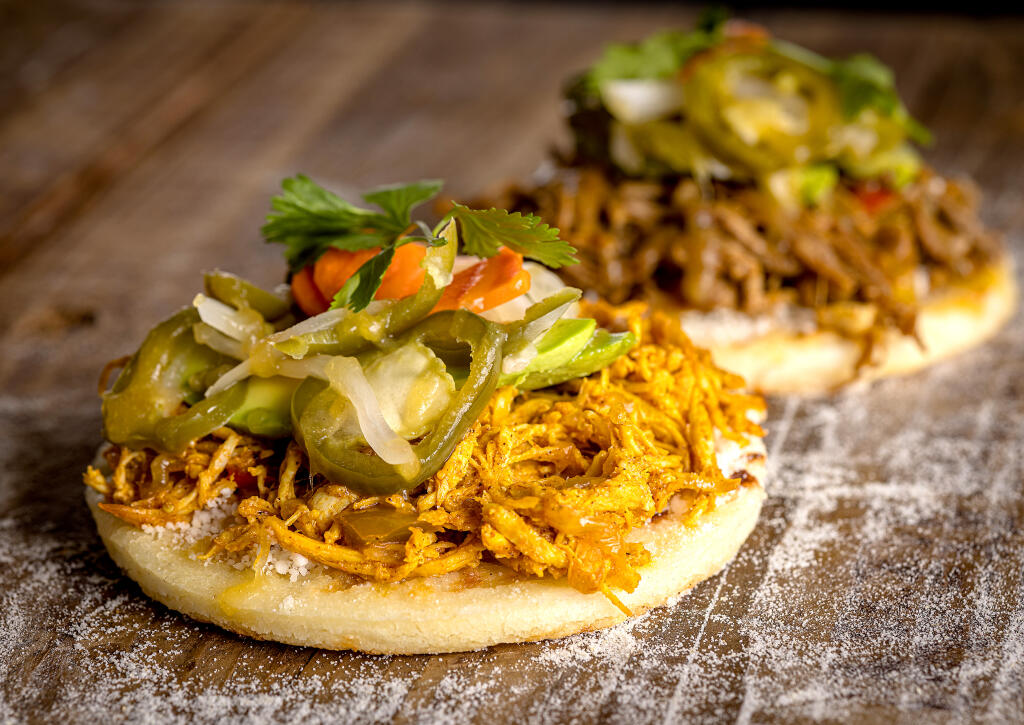 Colombian arepas with shredded beef or chicken from chef Cita Vivas,Tuesday, Aug. 8, 2023, in Santa Rosa. Vivas, a former salad and pastry chef for Stark’s Restaurant Group, sells her food at pop-ups around Sonoma County. (John Burgess / The Press Democrat)