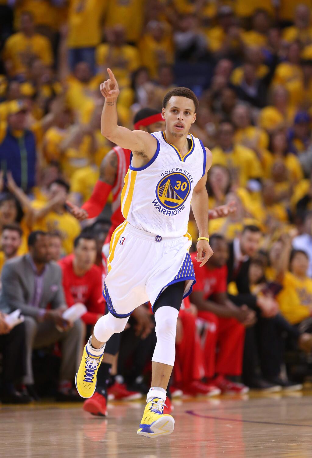 Golden State Warriors guard Stephen Curry celebrates after sinking a three-pointer against the Houston Rockets during Game 1 of the NBA Playoffs Western Conference Finals at Oracle Arena, in Oakland on Tuesday, May 19, 2015. The Warriors defeated the Rockets 110-106.(Christopher Chung/ The Press Democrat)