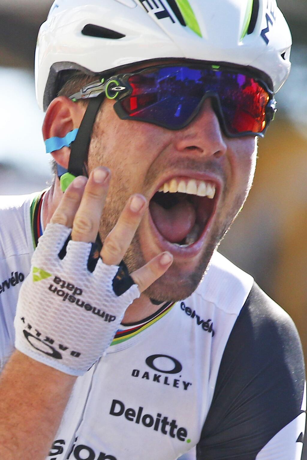 Britain's Mark Cavendish flashes four fingers for his fourth victory in this year's Tour de France as he crosses the finish line to win the fourteenth stage of the Tour de France cycling race over 208.5 kilometers (129.2 miles) with start in Montelimar and finish in Villars-les-Dombes, France, Saturday, July 16, 2016. (AP Photo/Peter Dejong)
