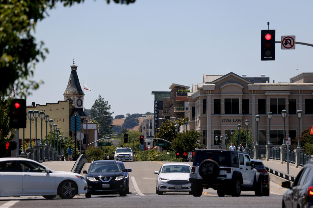 Cars drive over the First Street bridge in downtown Napa, Thursday, June 29, 2023. (Beth Schlanker / The Press Democrat file)