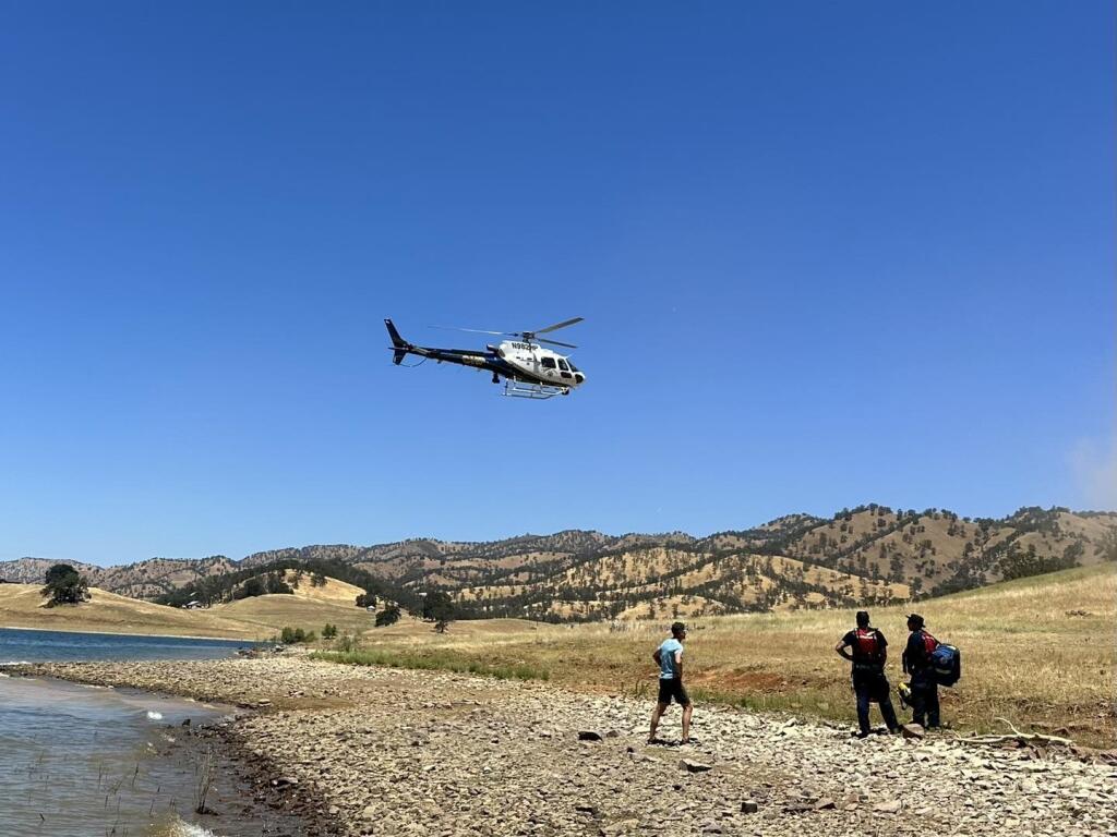 California Highway Patrol helicopter, H-32, on Saturday, July 8, 2023, airlifted a person injured in a paragliding accident near Lake Berryessa in Napa County to Kaiser Permanente Vacaville Medical Center. (CHP-Golden Gate Division Air Operations / Facebook)