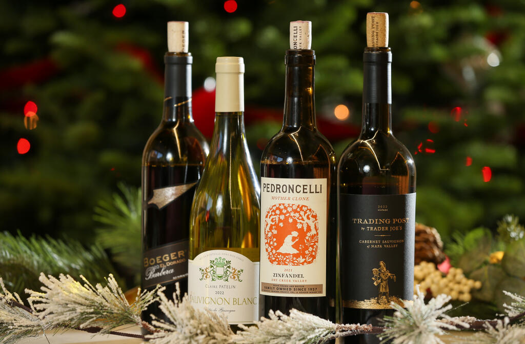 Some of the best wines to buy at Trader Joe’s for the holidays include Boeger Winery’s 2020 barbera, left, sauvignon blanc from French winemaker Claire Patelin, zinfandel from Pedroncelli and a cabernet sauvignon from Trader Joe’s new Trading Post label. (Christopher Chung/The Press Democrat)