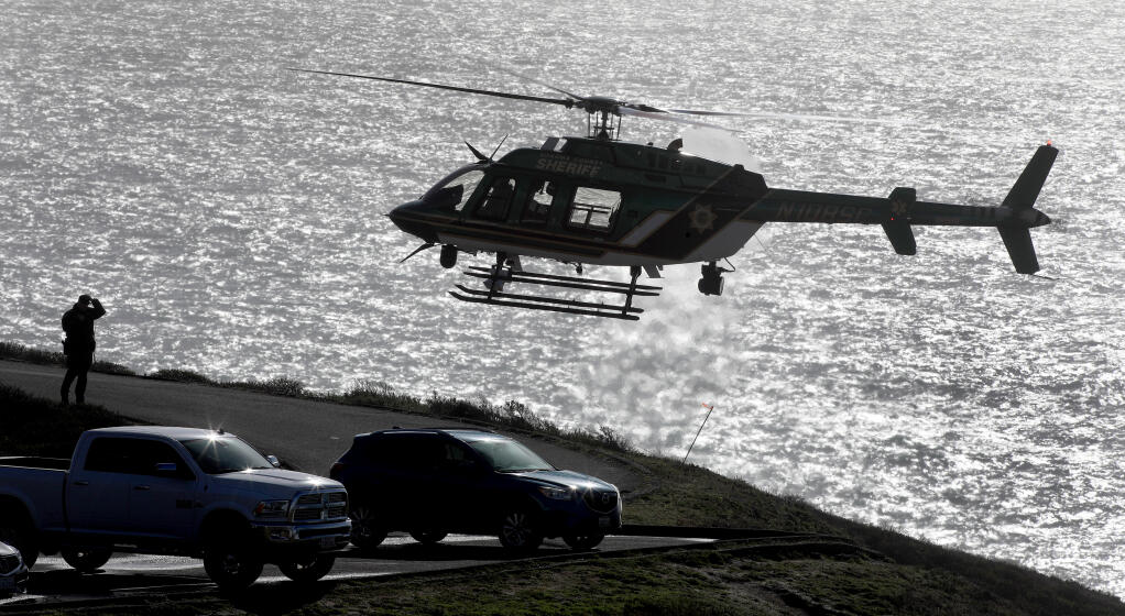 Henry 1, the Sonoma County Sheriff's helicopter team, Monday, Jan. 4, 2020, was called in to help search for two missing children that were swept away in the surf at Blind Beach, Sunday afternoon. (Kent Porter / The Press Democrat)
