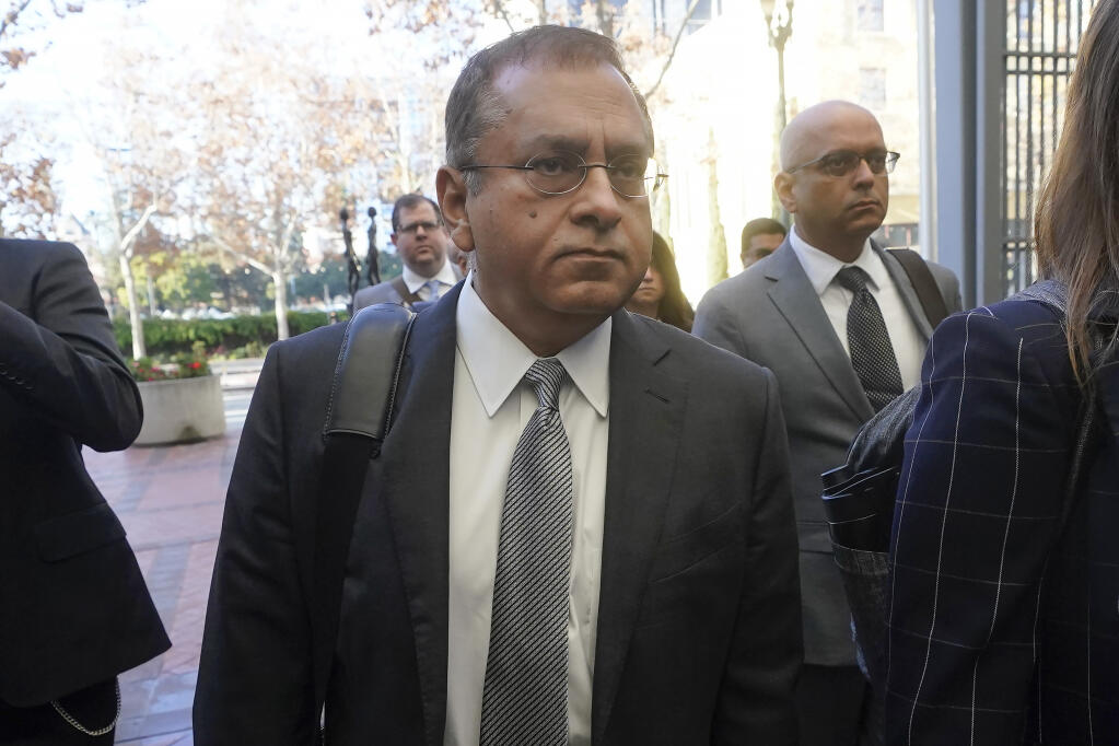 FILE - Ramesh "Sunny" Balwani, the former lover and business partner of Theranos CEO Elizabeth Holmes, arrives at federal court in San Jose, Calif., on Dec. 7, 2022. On Thursday, March 9, 2023, a federal judge rejected Balwani’s bid to remain free while he appeals his conviction for crimes he committed during a blood-testing scam that he orchestrated with Elizabeth Holmes. (AP Photo/Jeff Chiu, File)