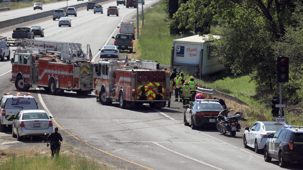 Emergency vehicles line the on-ramp to south Highway 101 from River Road north of Santa Rosa, Thursday, April 30, 2020 at the scene of a vehicle crash that injured several children and adults. (Kent Porter / The Press Democrat) 2020