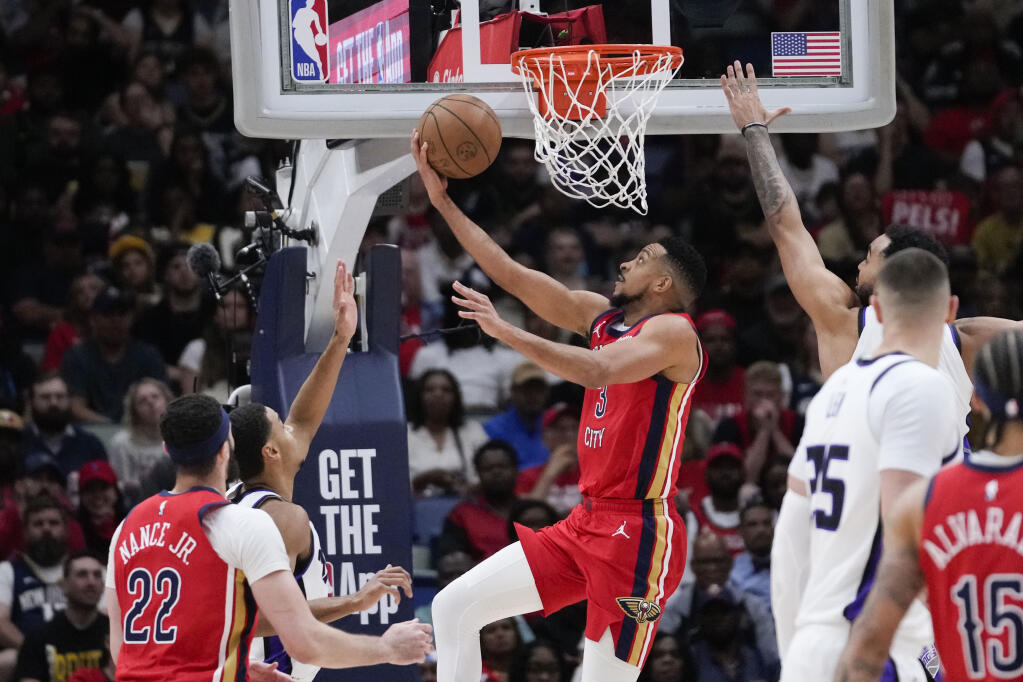 Pelicans guard CJ McCollum goes to the basket in the first half of a play-in tournament game against the Sacramento Kings in New Orleans, Friday, April 19, 2024. (Gerald Herbert / ASSOCIATED PRESS)
