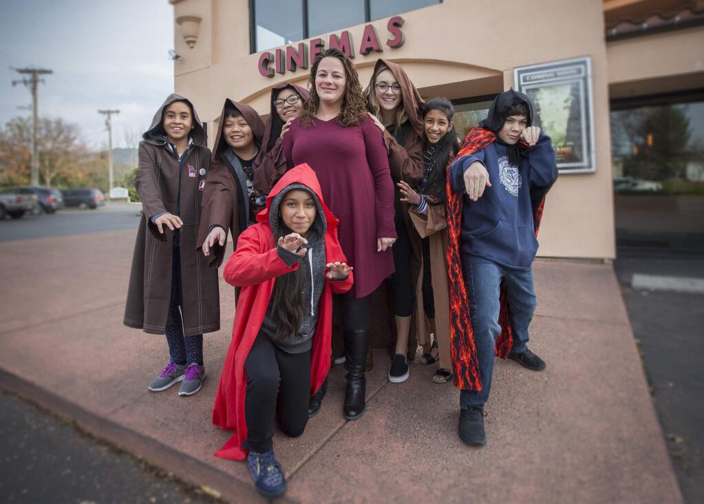 Altamira Vice Principal Christina Towner (center), with students from the middle school's Jedi English Class, during a morning field trip to see 'The Last Jedi'