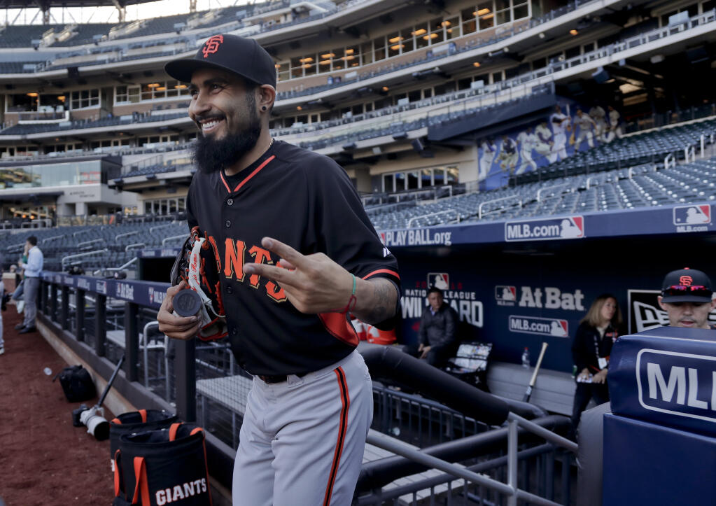 San Francisco Giants relief pitcher Sergio Romo walks onto the field during a workout for the National League wild-card game against the Mets, Tuesday, Oct. 4, 2016, in New York. (Julie Jacobson / ASSOCIATED PRESS)