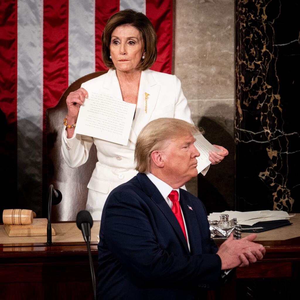 Speaker Nancy Pelosi rips a copy of President Donald Trump's speech at the conclusion of his State of the Union address. (ERIN SCHAFF / New York Times)