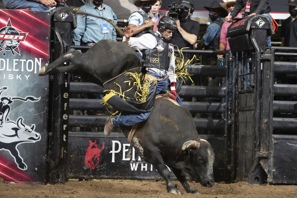In this photo provided courtesy of the PBR/Bull Stock Media shows Amadeu Campos Silva rides the bull Yippee High Cowboy in Grand Rapids, Mich., in August, 2021. The Brazilian bull rider was killed Sunday, Aug. 29, 2021, when his spur got caught in a rope, pulling him under the bull, and the animal stepped on his chest in California, according to the Professional Bull Riders touring group. Silva, 22, was competing at a bull-riding Velocity Tour event at the Save Mart Center in Fresno, said Andrew Giangola, a spokesperson for Professional Bull Riders. He was pronounced dead at a hospital. (Andre Silva/Courtesy PBR/Bull Stock Media via AP)
