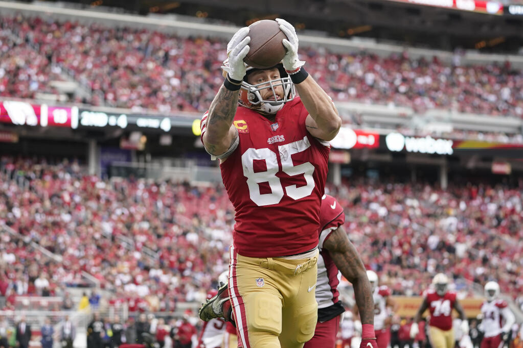 San Francisco 49ers tight end George Kittle (85) catches a touchdown against the Arizona Cardinals during the first half of an NFL football game in Santa Clara, Calif., Sunday, Jan. 8, 2023. (AP Photo/Godofredo A. Vásquez)