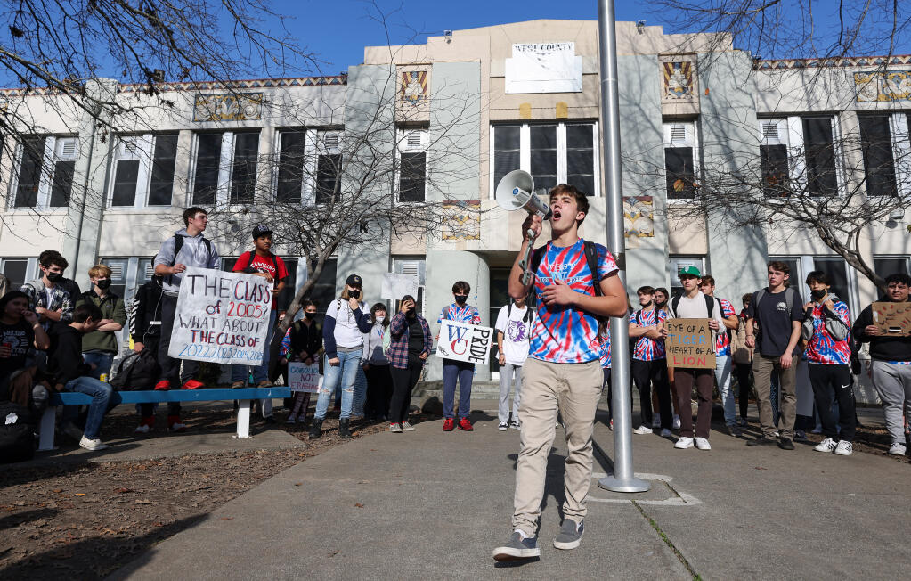 Tyler Sword leads fellow students in chants in front of West County High School in Sebastopol on Thursday, Dec. 2, 2021. Students walked out during their fourth period classes to protest a decision by trustees to change the school's name back to Analy. (Christopher Chung/ The Press Democrat)