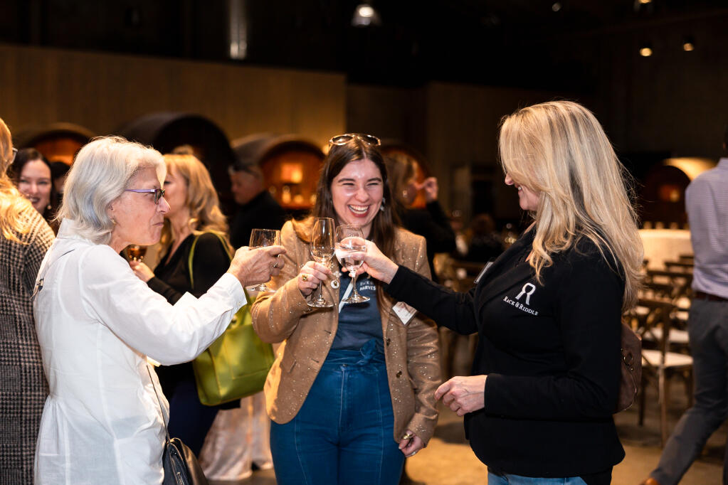 From left: Penelope Gadd-Coster, Stephanie Beckman and Cynthia Faust of Trailblazer Award Sponsor Rack and Riddle share a toast during a North Bay Business Journal's Women in Wine Awards held at St. Helena's Louis M. Martini Winery on Wednesday, Nov. 8, 2023. (Loren Hansen Photography)