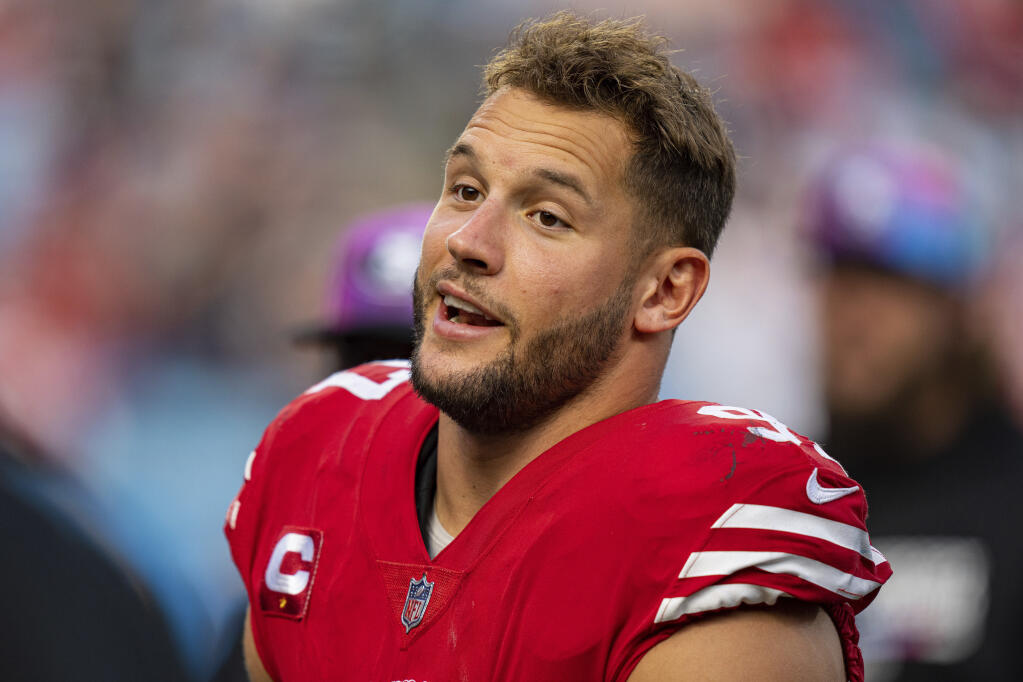 San Francisco 49ers defensive end Nick Bosa (97) looks on during an NFL football game against the Carolina Panthers on Sunday, Oct. 9, 2022, in Charlotte, N.C. (AP Photo/Jacob Kupferman)