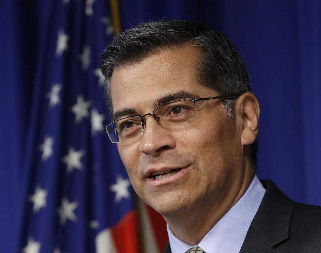 FILE -- In this May 3, 2017 file photo, California Attorney Gen. Xavier Becerra speaks in Sacramento, Calif. California's attorney general says the number of hate crimes increased about 11 percent last year, the second consecutive double-digit increase after years of decline. The report released Monday, July 3, 2017 shows 931 hate crimes statewide in 2016, nearly 100 more than in 2015. (AP Photo/Rich Pedroncelli, file)