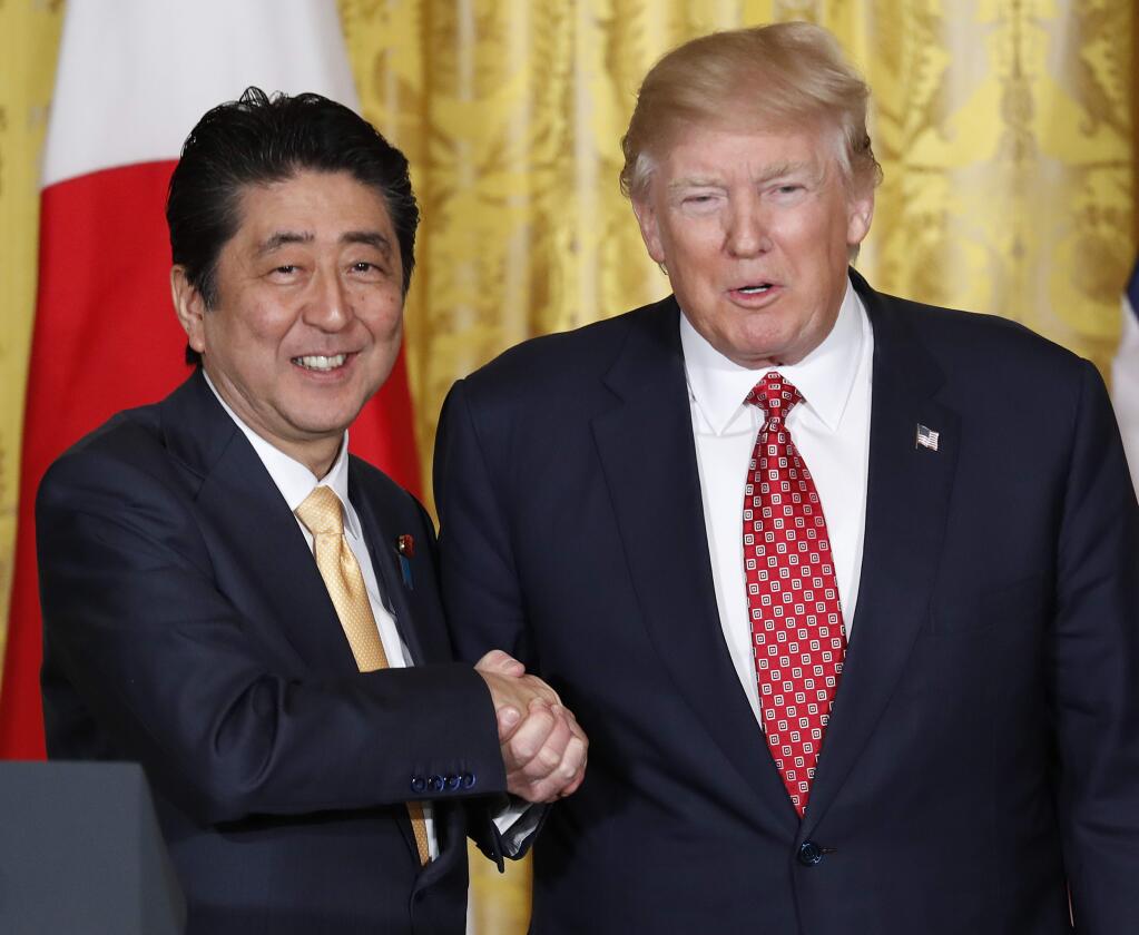 President Donald Trump and Japanese Prime Minister Shinzo Abe shake hands after their joint news conference in the East Room of the White House in Washington, Friday, Feb. 10, 2017. (AP Photo/Pablo Martinez Monsivais)