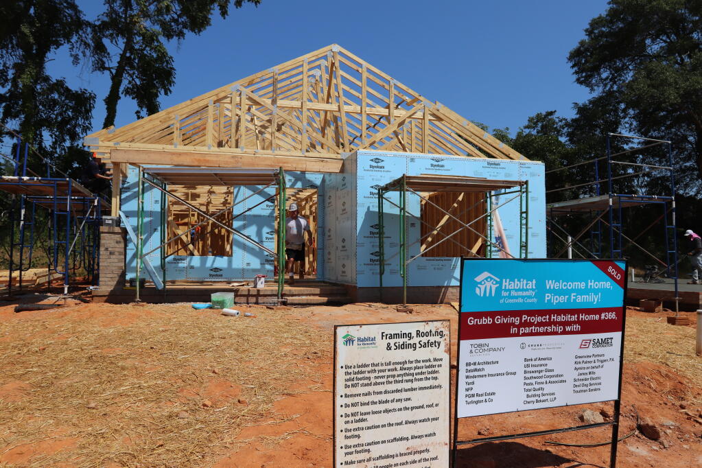 In this photo provided by Habitat for Humanity of Greenville County, a home is constructed by Habitat for Humanity on Sept. 12, 2019, in Greenville, S.C. Reeling from massive cutbacks in volunteers during the COVID-19 pandemic, and grappling with high construction costs, Habitat for Humanity affiliates would be the first to admit they’re struggling. (Habitat for Humanity of Greenville County via AP)