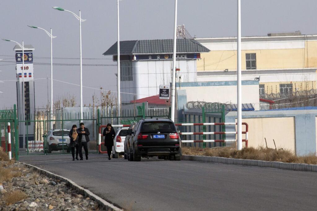 FILE.- In this Dec. 3, 2018, file photo, a police station is seen by the front gate of the Artux City Vocational Skills Education Training Service Center in Artux in western China's Xinjiang region. Confidential documents, leaked to a consortium of news organizations, lay out the Chinese government's deliberate strategy to lock up ethnic minorities to rewire their thoughts and the language they speak. One of the documents says that internment camps ‚Äì such as the one in Artux ‚Äì are to install police stations at gates, as well as other security measures to 'prevent escapes'. (AP Photo/File)