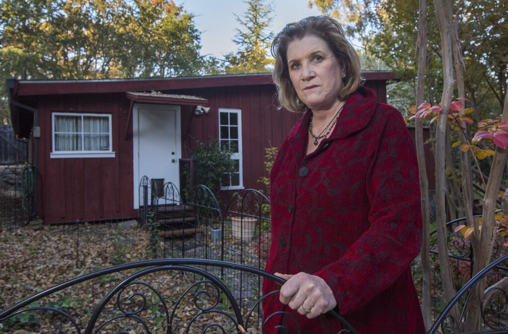 The ever-falling leaves brought fire inspectors to Jack London Estates this summer. Val Henderson spent $1,500 removing leaves from her Lakeside Drive cottage. 'But guess what? They're all back,' she said. (Photo by Robbi Pengelly/Index-Tribune)