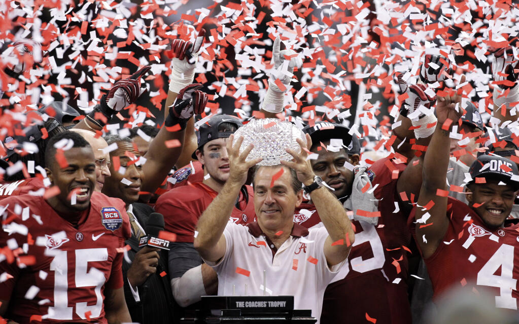 Alabama head coach Nick Saban celebrates with his team after winning the national championship against LSU in 2012. (Gerald Herbert / ASSOCIATED PRESS)