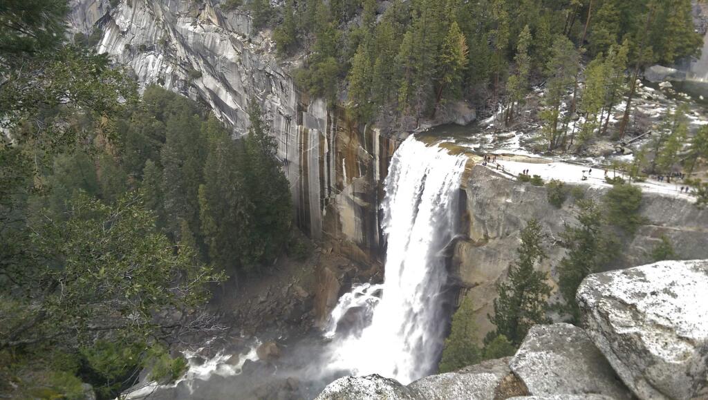 In this March 28, 2016 photo provided by the National Park Service, water plunges 300 feet over Vernal Fall onto the Merced River in Yosemite National Park, Calif. Waterfalls in Yosemite National Park will likely reach peak flows between now and May. Thunderstorms, showers and intense periods of rain on top of snow have unleashed snowmelt in Yosemite Valley. (National Park Service via AP)