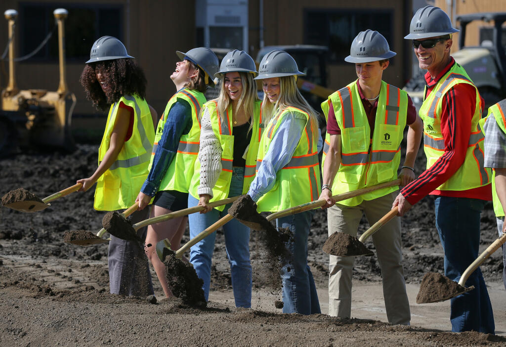 Associated Student Body students Lulia Embaye, left, Addison Klosevitz, Bella Clark, Delaney Detrick, Xander Newman, and adviser Jim La France take part in the groundbreaking ceremony for a new two-story building to be built at Montgomery High School in Santa Rosa, Wednesday, April 10, 2024. (Christopher Chung / The Press Democrat)