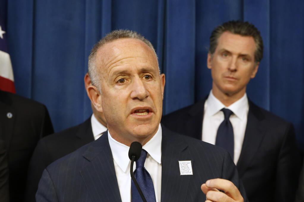 In this March 20, 2019, file photo, Sacramento Mayor Darrell Steinberg speaks at a news conference held by Gov. Gavin Newsom, right, in Sacramento, Calif. (AP Photo/Rich Pedroncelli, File)