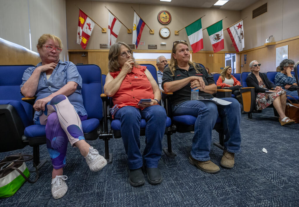 Lost Hearts & Souls Horse Rescue owner Betsy Bueno, on right in jeans, and Sandy Chiaroni, center, listen in Santa Rosa as Sonoma County Board of Supervisors, Tuesday, Aug. 15, 2023, hear public comment about a serious animal abuse case that resulted in the death of a horse. (Chad Surmick / The Press Democrat)