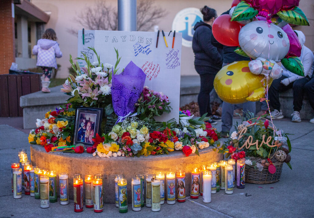 Flowers and candles light up a memorial at the entrance to Montgomery High School after a student fight resulted in the death of a 16-year-old student, Wednesday, March 1, 2023, in Santa Rosa. (Chad Surmick / The Press Democrat file)