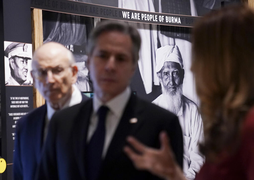 Secretary of State Antony Blinken tours the "Burma's Path To Genocide" exhibit at the United States Holocaust Memorial Museum, Monday, March 21, 2022 in Washington. Blinken says the violent repression of the largely Muslim Rohingya population in Myanmar amounts to genocide. The declaration on Monday is intended to both generate international pressure and lay the groundwork for potential legal action.  (Kevin Lamarque, Pool via AP)