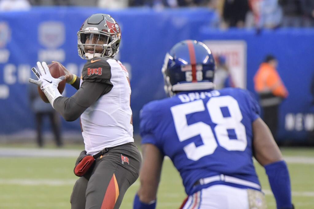 Tampa Bay Buccaneers quarterback Jameis Winston looks to pass during the second half against the New York Giants, Sunday, Nov. 18, 2018, in East Rutherford, N.J. (AP Photo/Bill Kostroun)