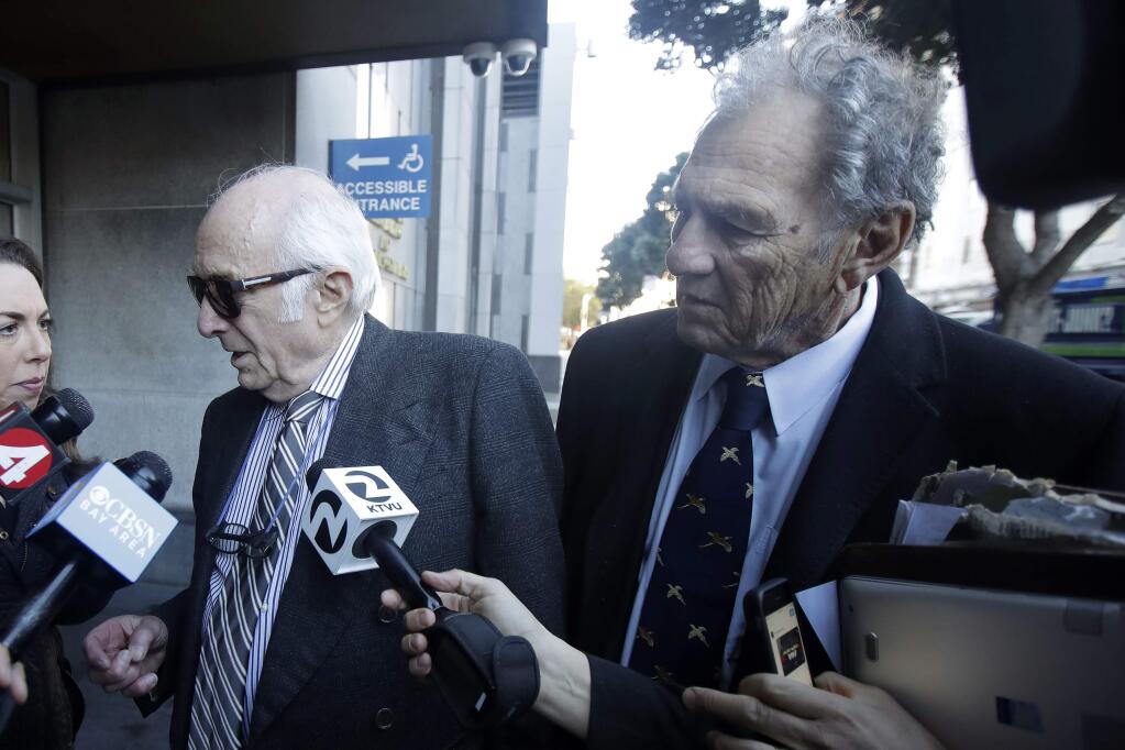 Attorneys Gil Eisenberg, left, and Michael Stepanian, both representing restaurateur Nick Bovis, speak to reporters outside of a federal courthouse in San Francisco, Thursday, Feb. 6, 2020. The FBI arrested public works director Mohammed Nuru and restaurateur Nick Bovis last week, saying the men schemed in 2018 to bribe a San Francisco airport commissioner for prime restaurant space at San Francisco International Airport. (AP Photo/Jeff Chiu)