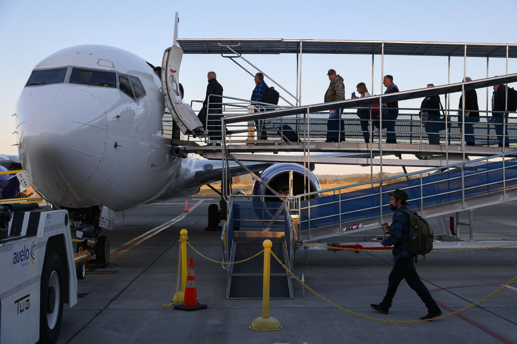 Passengers board the first Avelo Airlines flight from Santa Rosa to Kalispell, Montana, at the Charles M. Schulz-Sonoma County Airport in Santa Rosa, Wednesday, May 1, 2024.  (Christopher Chung / The Press Democrat)