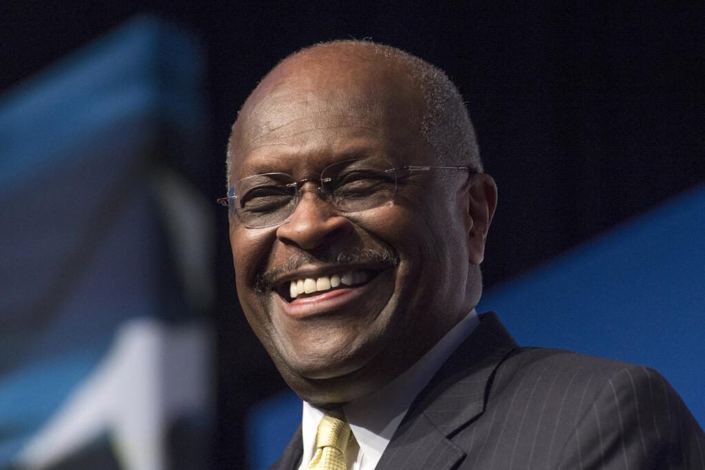 FILE - In this June 20, 2014, file photo, Herman Cain, CEO, The New Voice, speaks during Faith and Freedom Coalition's Road to Majority event in Washington. Cain is being treated for the coronavirus at an Atlanta-area hospital. That's according to a statement posted on his Twitter account Thursday, July 2, 2020. (AP Photo/Molly Riley, File)