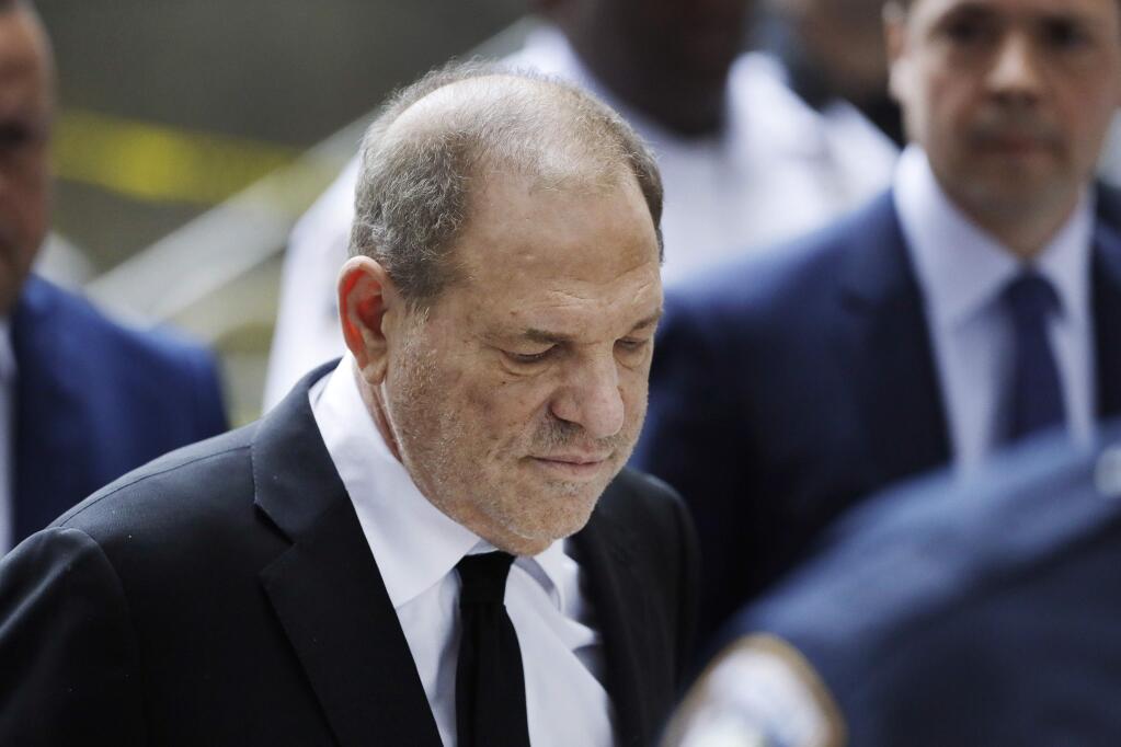 In this Aug. 26, 2019, photo, Harvey Weinstein arrives in court in New York. A new book by The New York Times reporters who uncovered sexual misconduct accusations against Weinstein includes new details on the movie mogul's attempts to stop the newspaper from publishing the story. (AP Photo/Mark Lennihan)