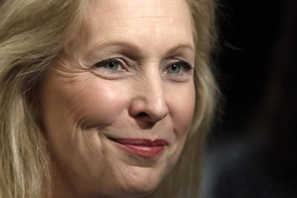 Democratic presidential candidate Sen. Kirsten Gillibrand, D-N.Y., listens to a reporter's question after a mental health roundtable discussion, Tuesday, Aug. 20, 2019, in Manchester, N.H. (AP Photo/Elise Amendola)